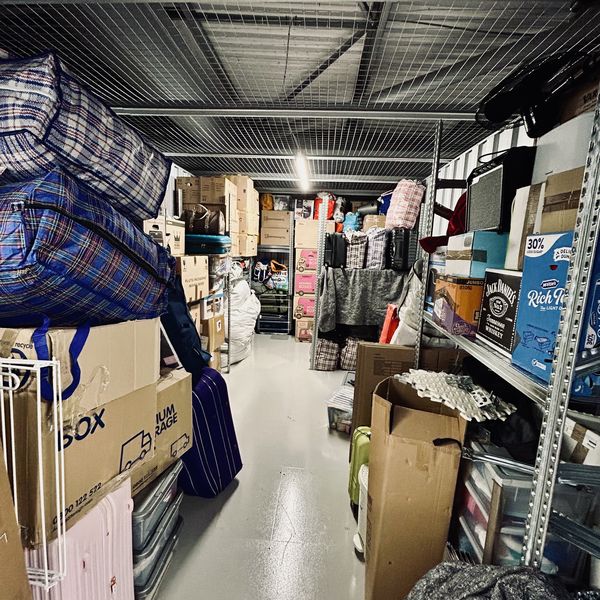 A storage unit packed with a customer's boxes and furniture